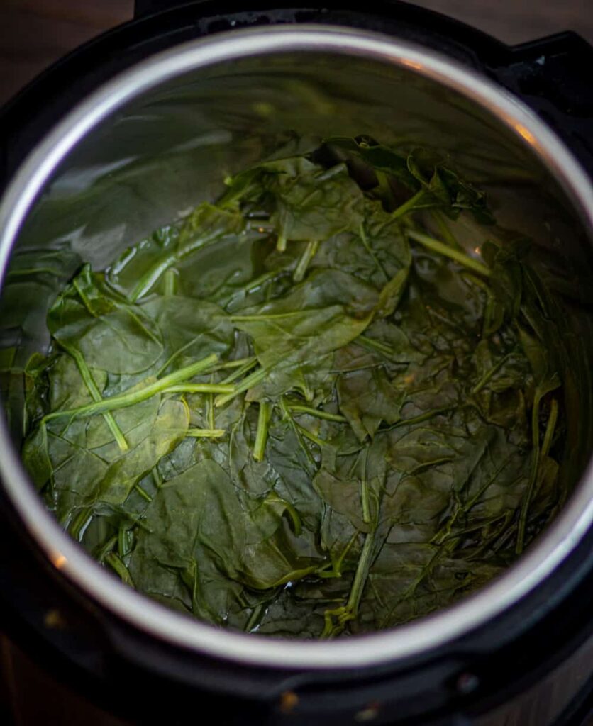 After pressure cooking the spinach leaves will shrink in size