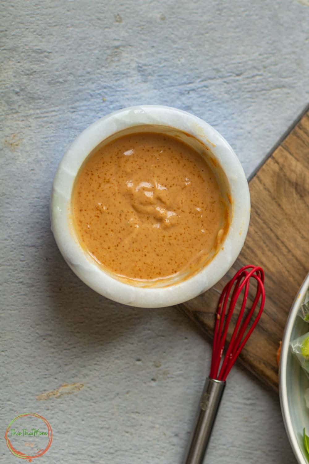Spicy Peanut Sauce in a white bowl.
