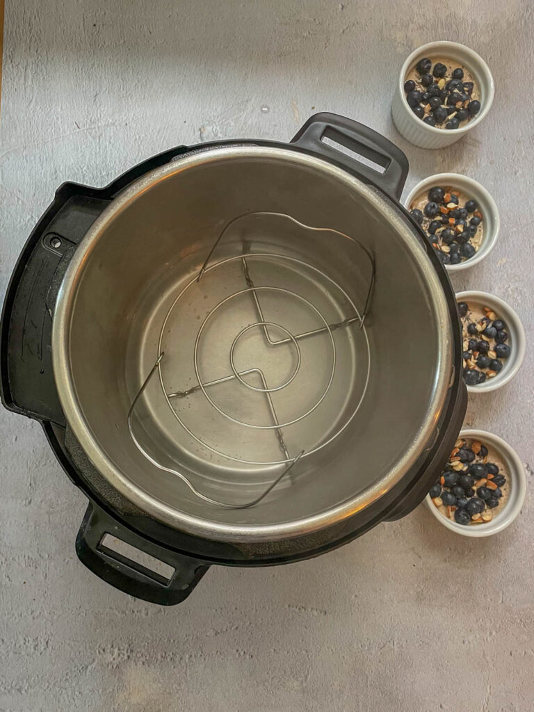 Add water in the Instant Pot and boil the water. Place trivet in the Instant Pot.