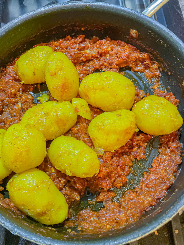 add boiled potatoes to the masala