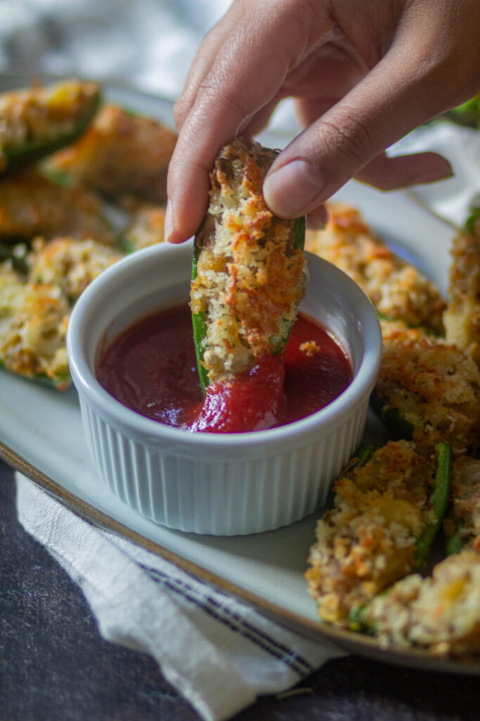 air fryer jalapeno poppers dipped in the ketchup