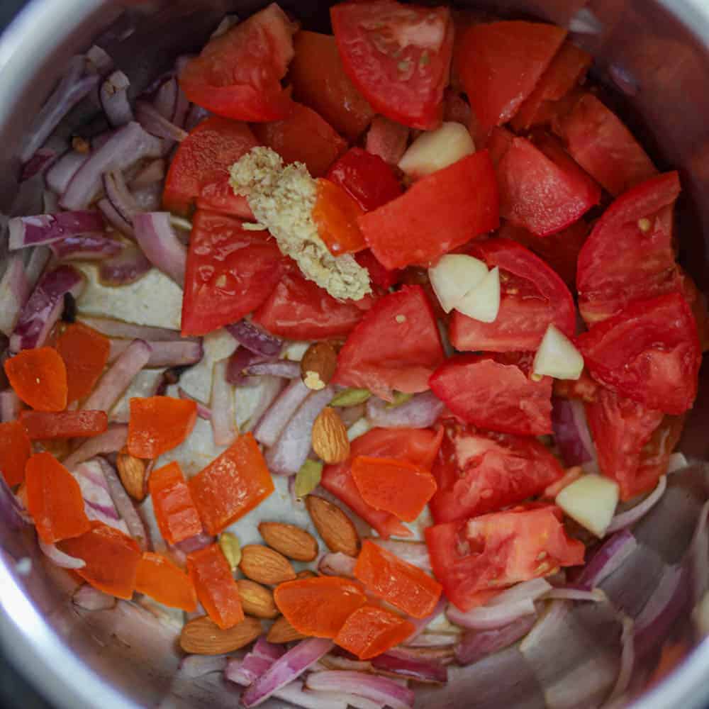 add tomatoes, nuts, dried fruits, and whole spices