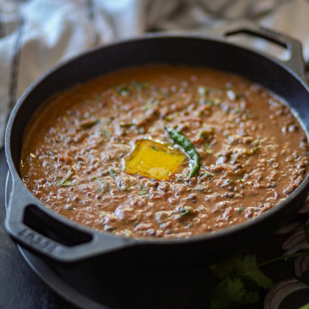 Instant Pot Dal Makhani topped with butter.