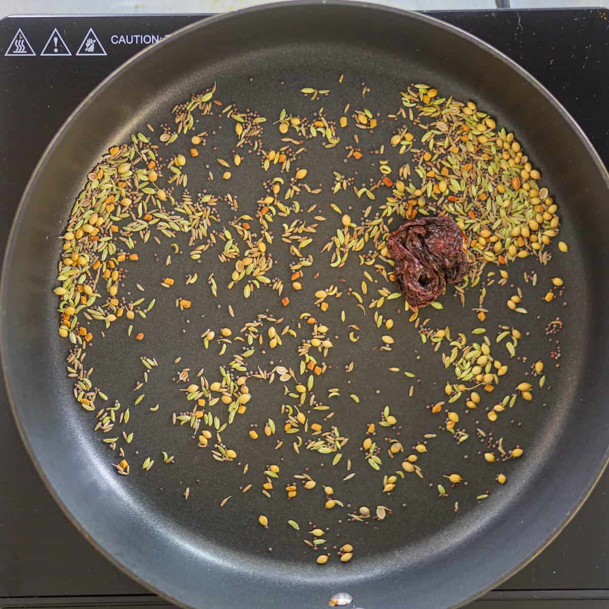 Roast the spices at low-heat in a pan.