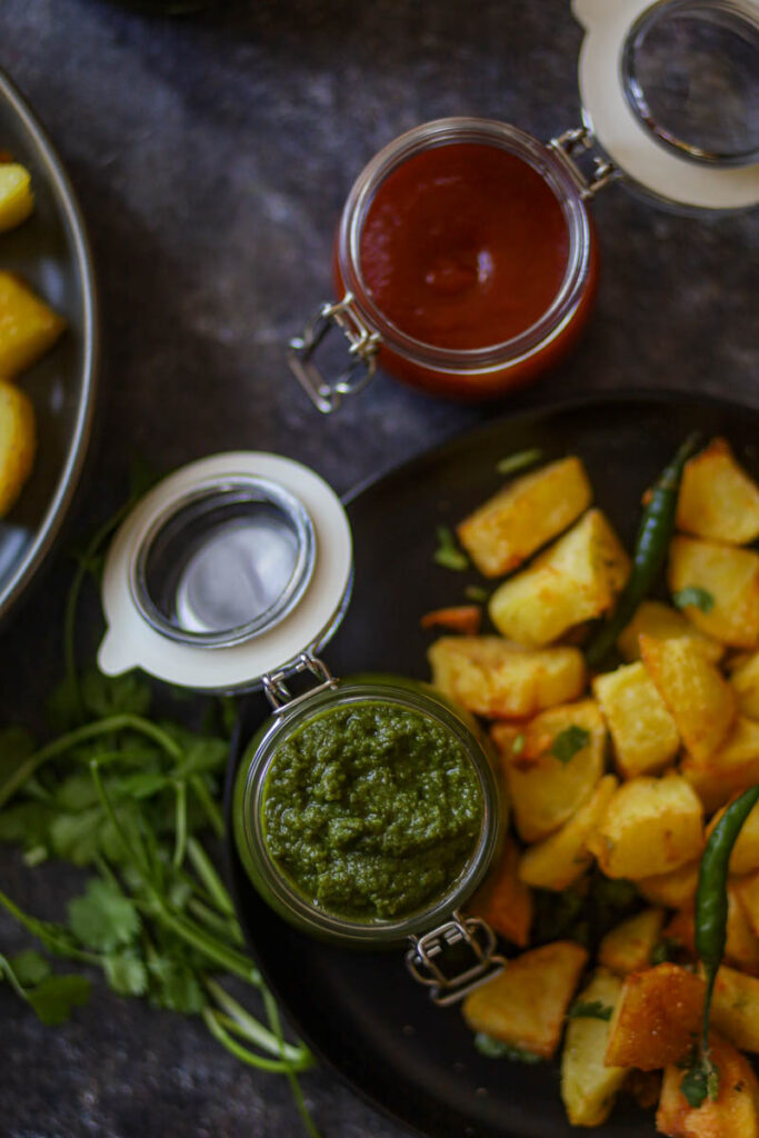 green chutney is served with potato fritters.