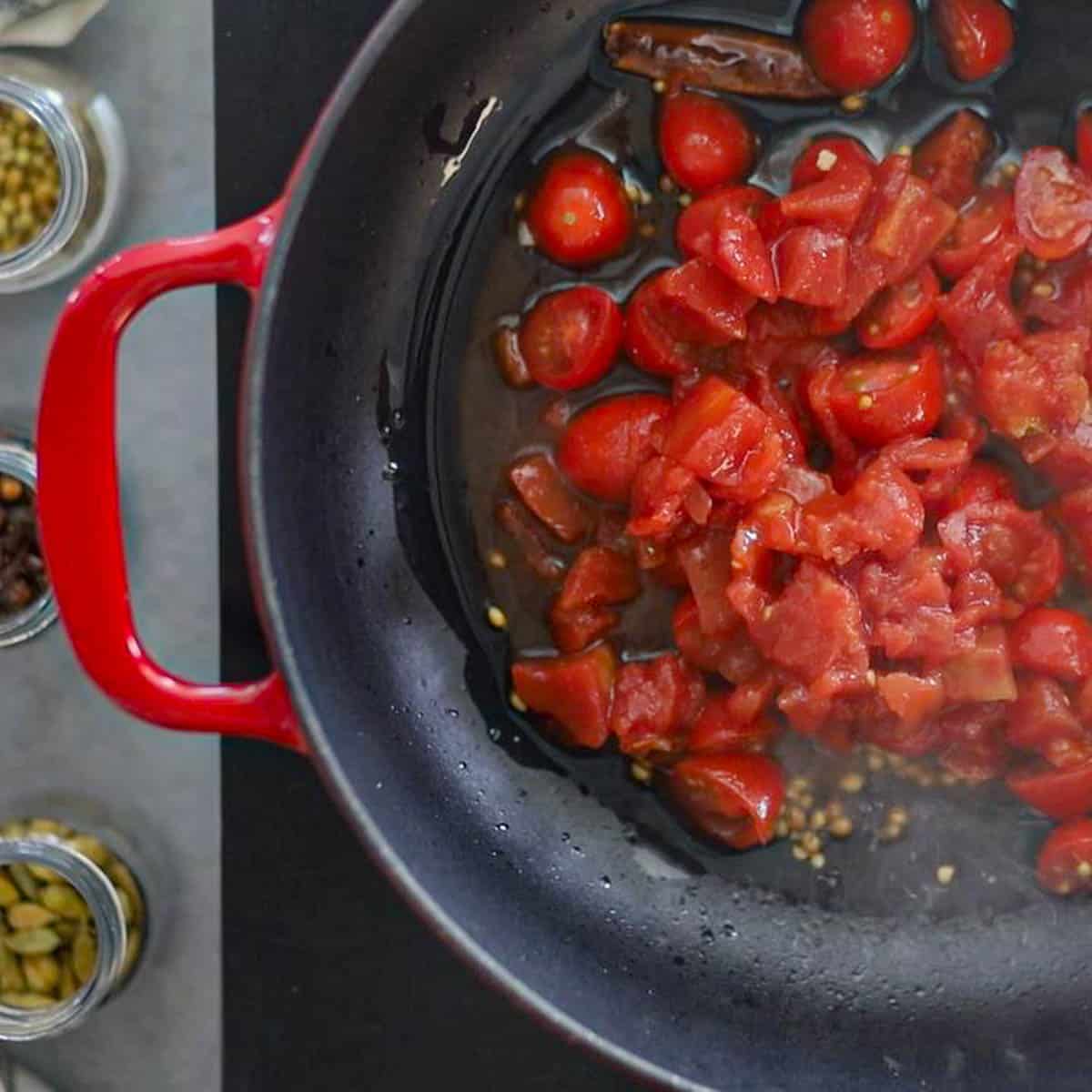 Saute tomatoes in oil until soft & mushy.