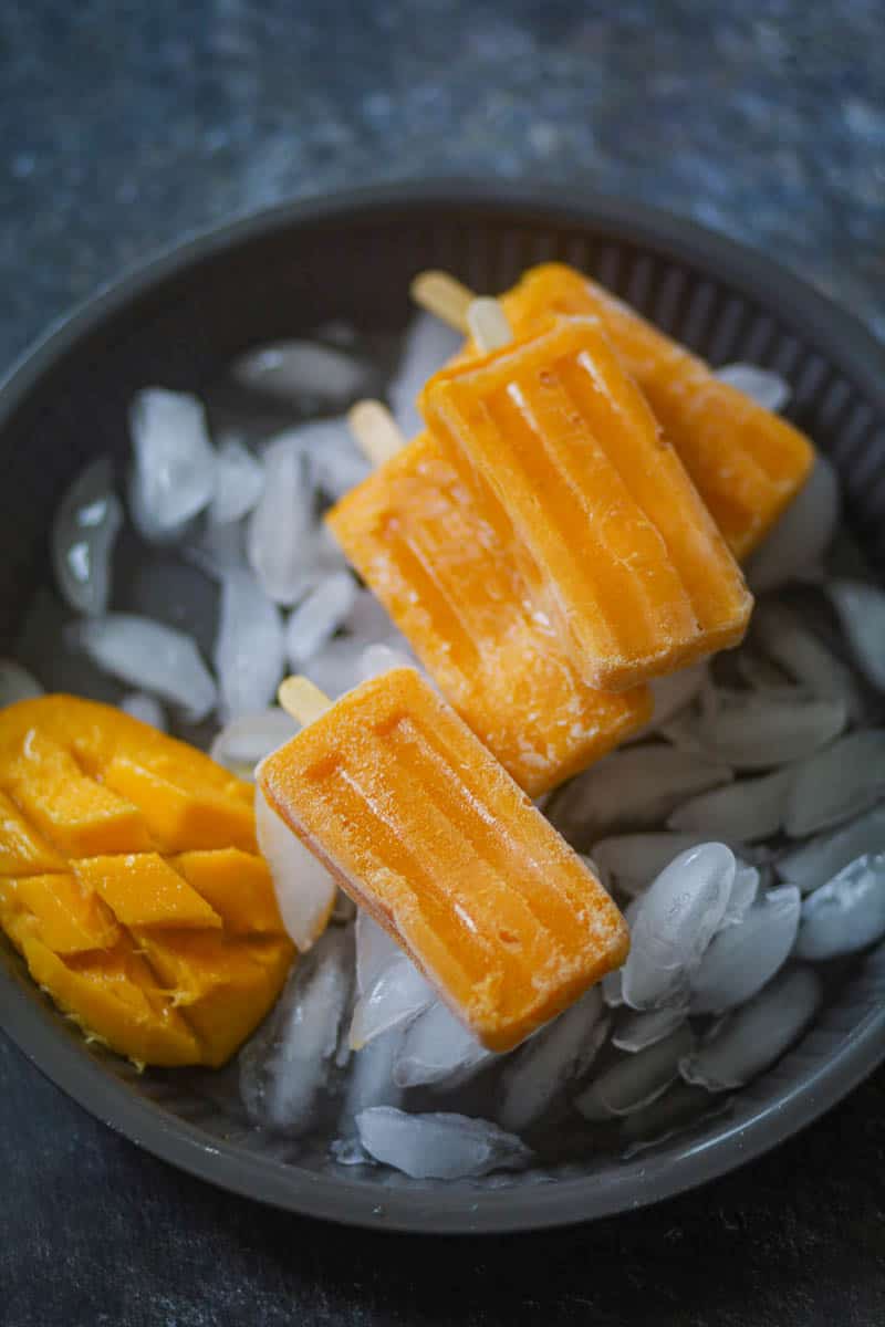 Popsicle over some ice cubes.