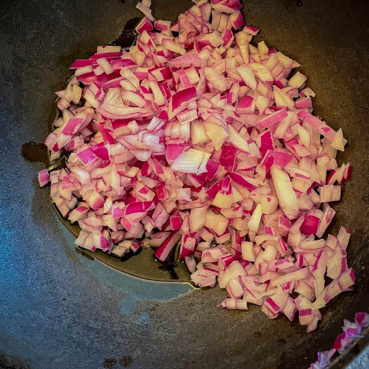 Add onion in a skillet.