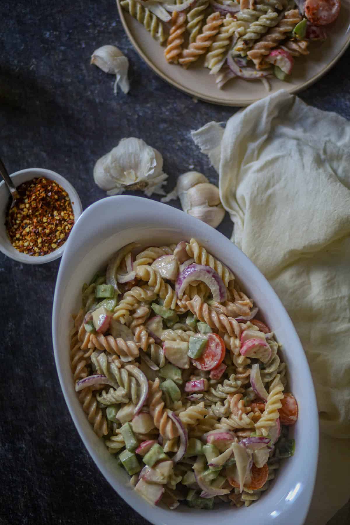 Tricolor Pasta Salad served in a white bowl.